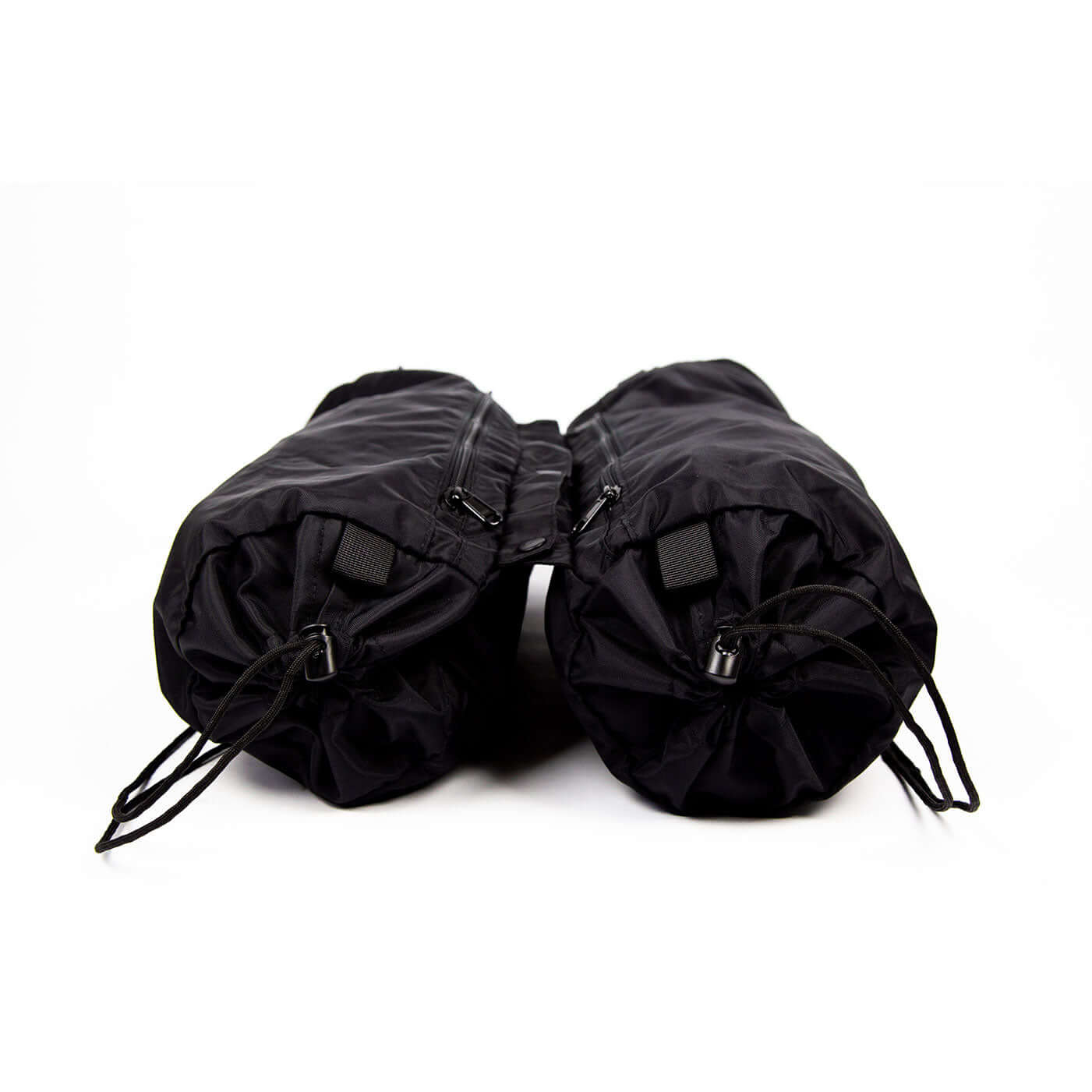 Pair of black Trailform Switch Bags showing a cylindrical design with drawstring closures for easy packing and organization.